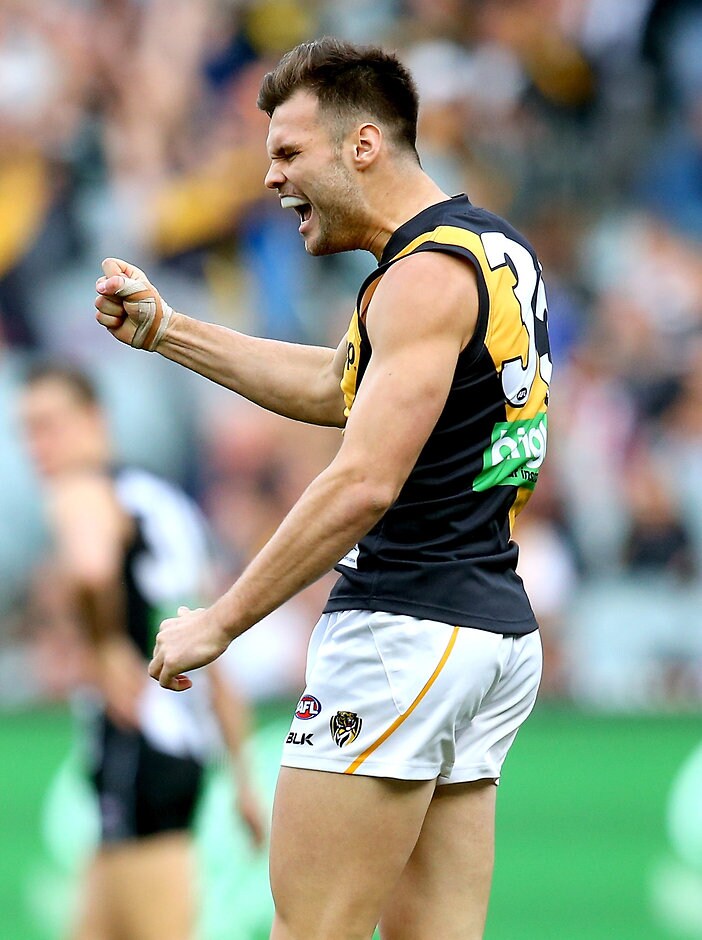 AFL 2015 Rd 21 - Collingwood v Richmond MELBOURNE, AUSTRALIA - AUGUST 22: Ben Lennon of the Tigers celebrates a goal during the 2015 AFL round 21 match between the Collingwood Magpies and the Richmond Tigers at the Melbourne Cricket Ground, Melbourne, Australia on August 22, 2015. (Photo by Justine Walker/AFL Media)